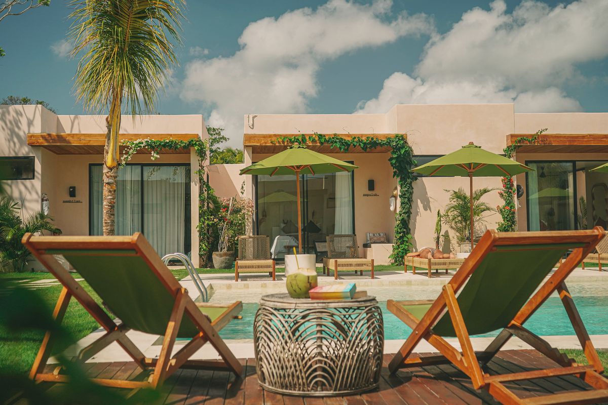 The pool, loungers and garden studios at Nema. Uluwatu