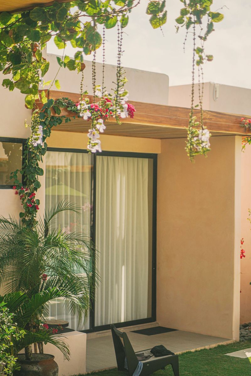 A terrace framed by hanging bougainvillea
